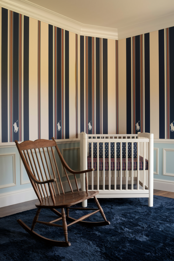 In a beautifully appointed nursery bathed in warm, inviting light, soft pastel stripes and plaids adorn the walls in shades of navy, white, and red, creating a timeless and elegant atmosphere. A vintage-style rocking chair, its wooden frame gently worn by time, stands proudly near a plush, navy rug, while subtle polo bear prints decorate select pieces of furniture, adding a touch of whimsy and charm.
